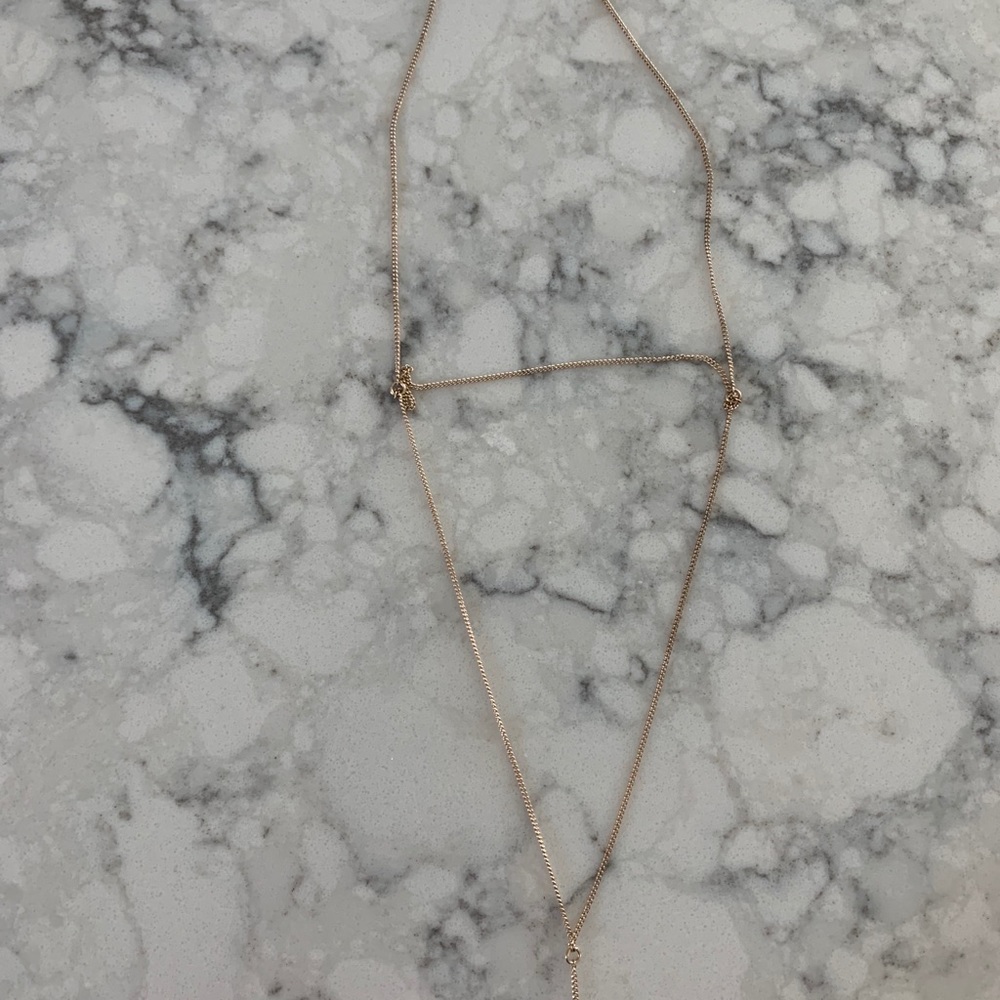 Leaf plated gold tiered necklace. Long